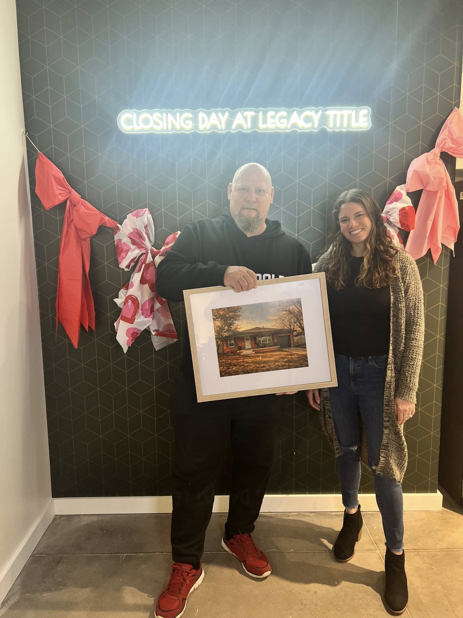 Tessa Hood Realtor with clients on first home closing day – Legacy Title Oklahoma