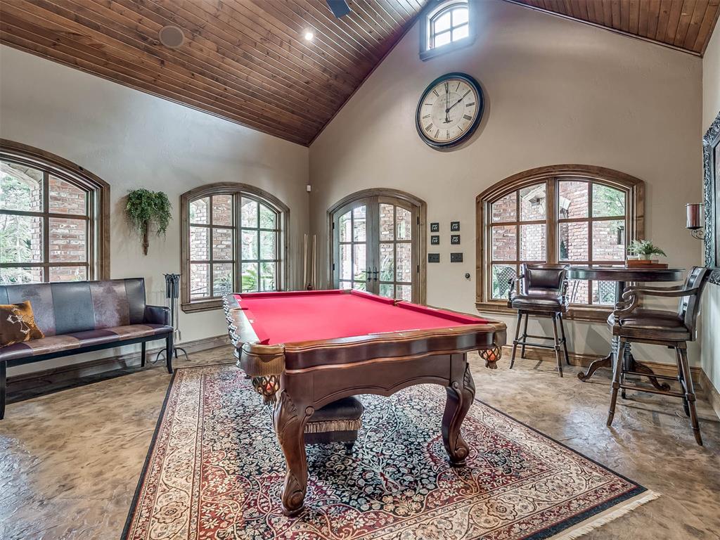 Tessa Hood Realtor – Billiard room with vaulted wood ceiling and arched windows at 1705 Maple Dr, Blanchard Oklahoma