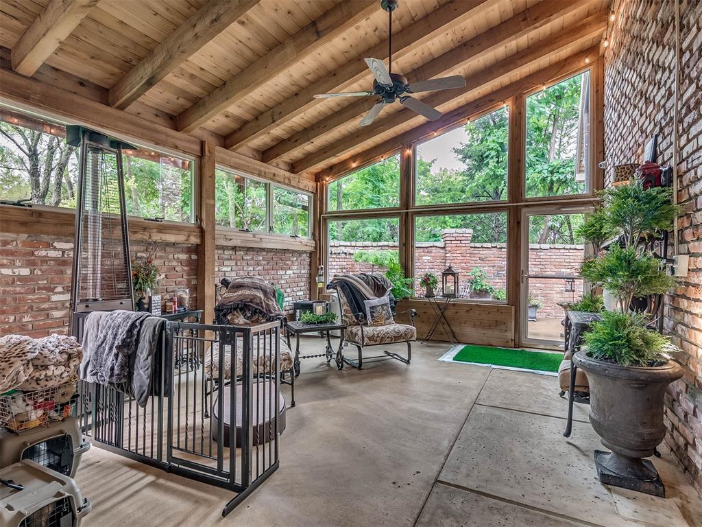 Tessa Hood Realtor – Glass sunroom with wood beam ceiling and garden views at 1705 Maple Dr, Blanchard Oklahoma