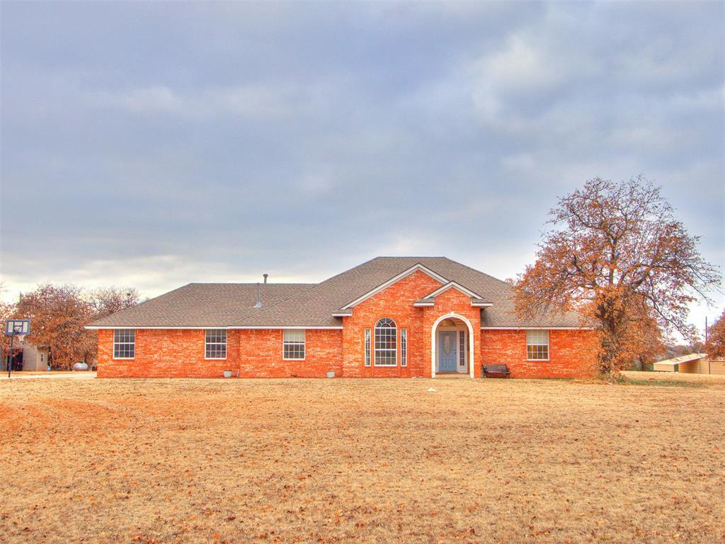 Tessa Hood Realtor – Brick ranch exterior with arched entry at 5879 Mockingbird Ln, Blanchard Oklahoma