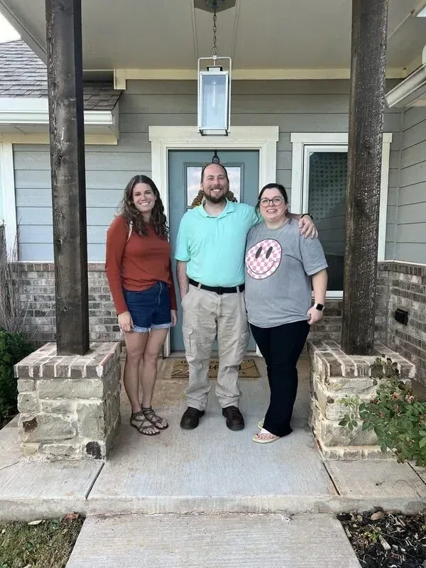 Tessa Hood Realtor with new home buyers at their front door – Newcastle Oklahoma