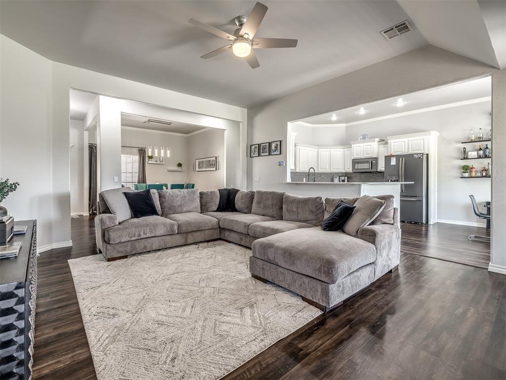 Tessa Hood Realtor – Open concept living room with view to kitchen and dining at 6910 Rolling Meadows Dr, Tuttle Oklahoma
