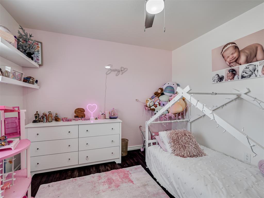 Tessa Hood Realtor – Secondary bedroom with hardwood floors at 6910 Rolling Meadows Dr, Tuttle Oklahoma