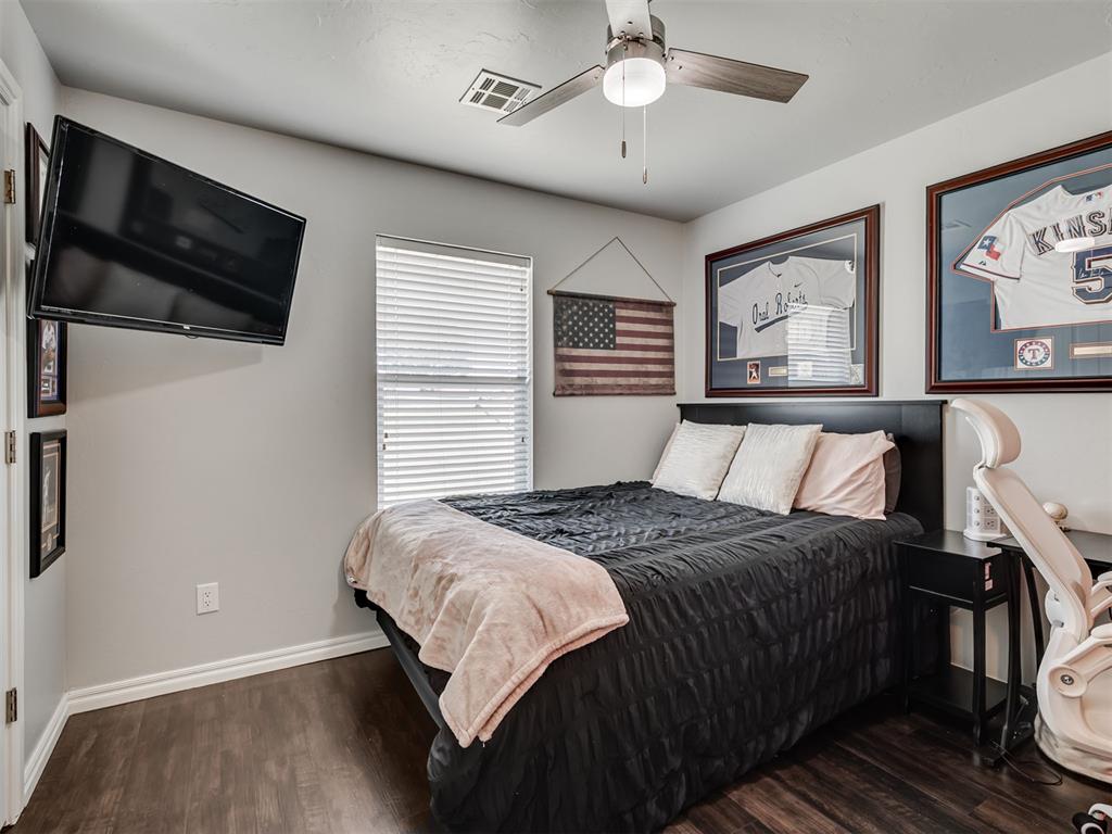 Tessa Hood Realtor – Secondary bedroom with ceiling fan and hardwood floors at 6910 Rolling Meadows Dr, Tuttle Oklahoma