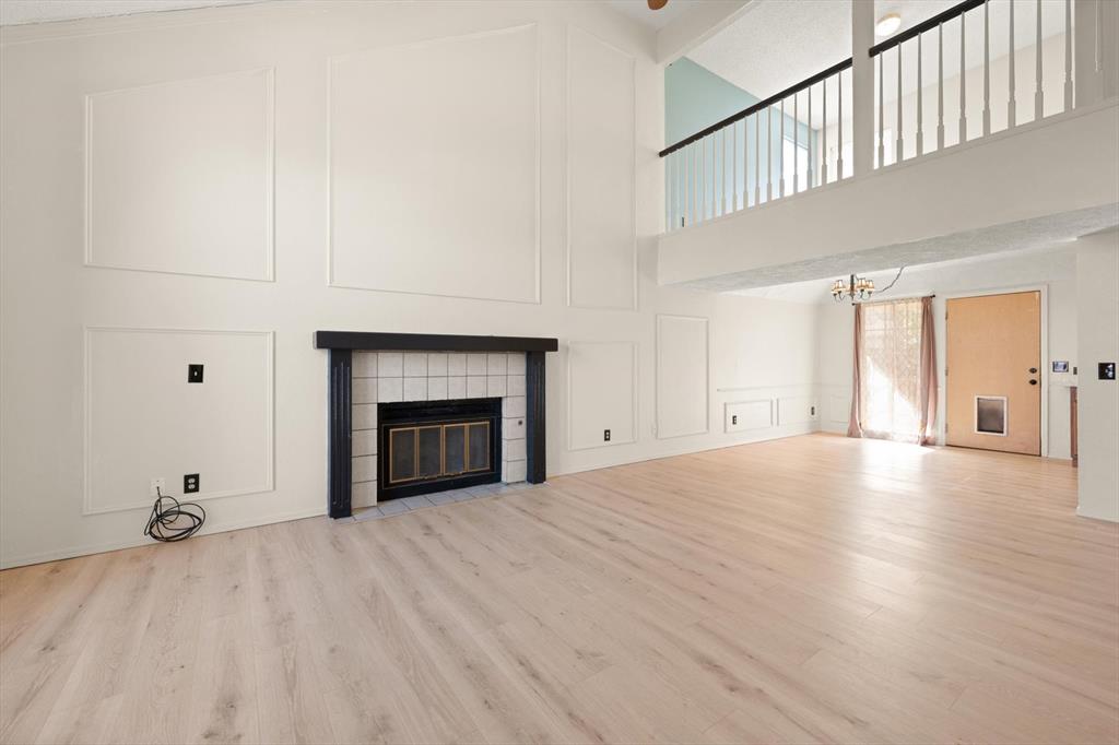 Tessa Hood Realtor – Living room fireplace with board-and-batten accent wall at 2028 Rose Court, Norman Oklahoma