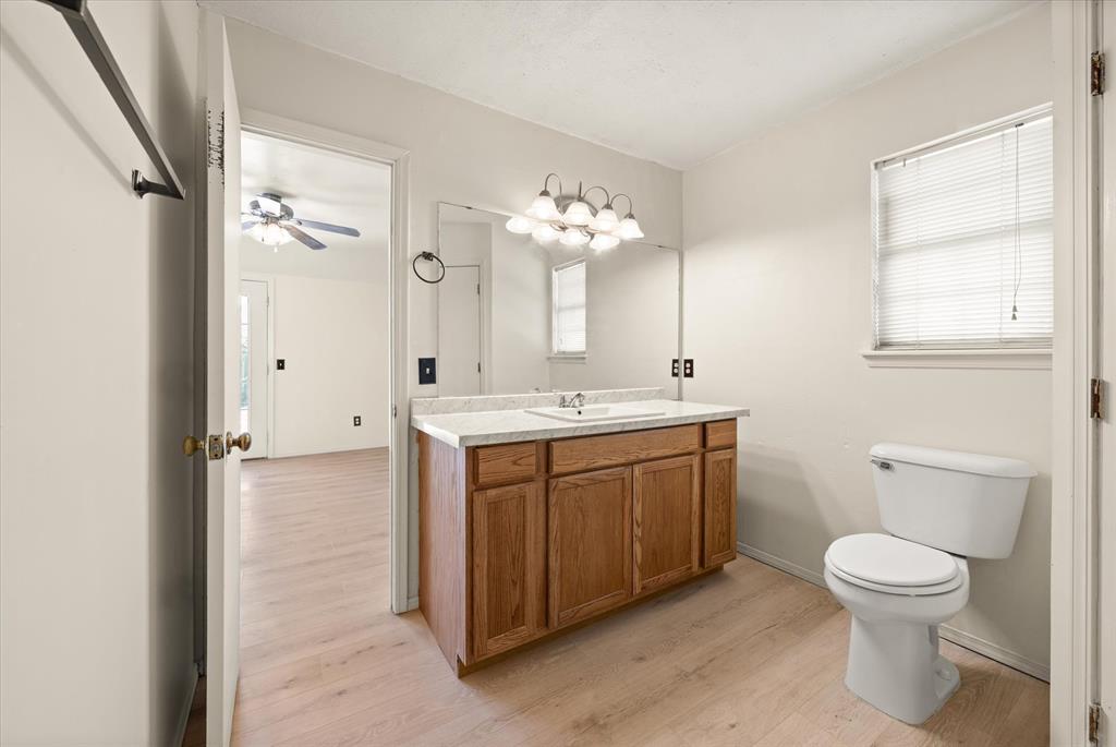 Tessa Hood Realtor – Primary bathroom vanity with updated marble countertop at 2028 Rose Court, Norman Oklahoma