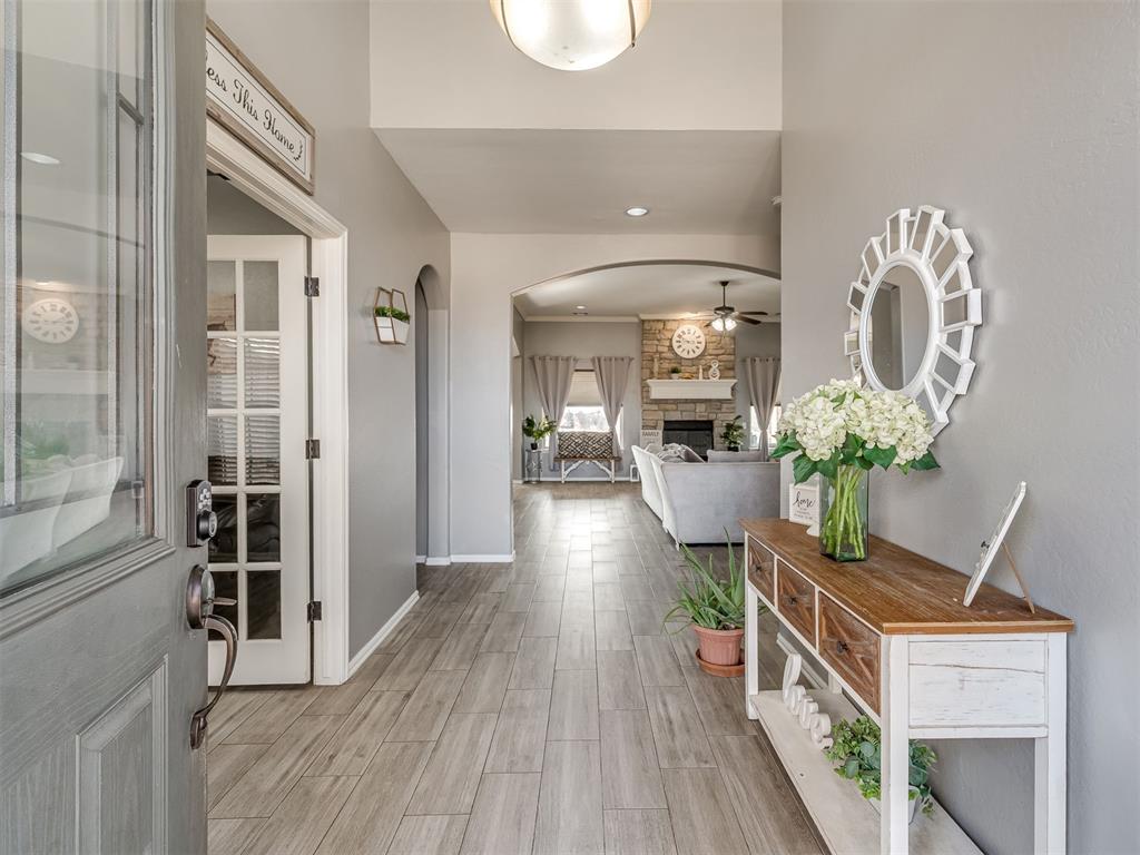 Tessa Hood Realtor – Foyer open to living room with stone fireplace at 5708 SE 148th St, Oklahoma City OK