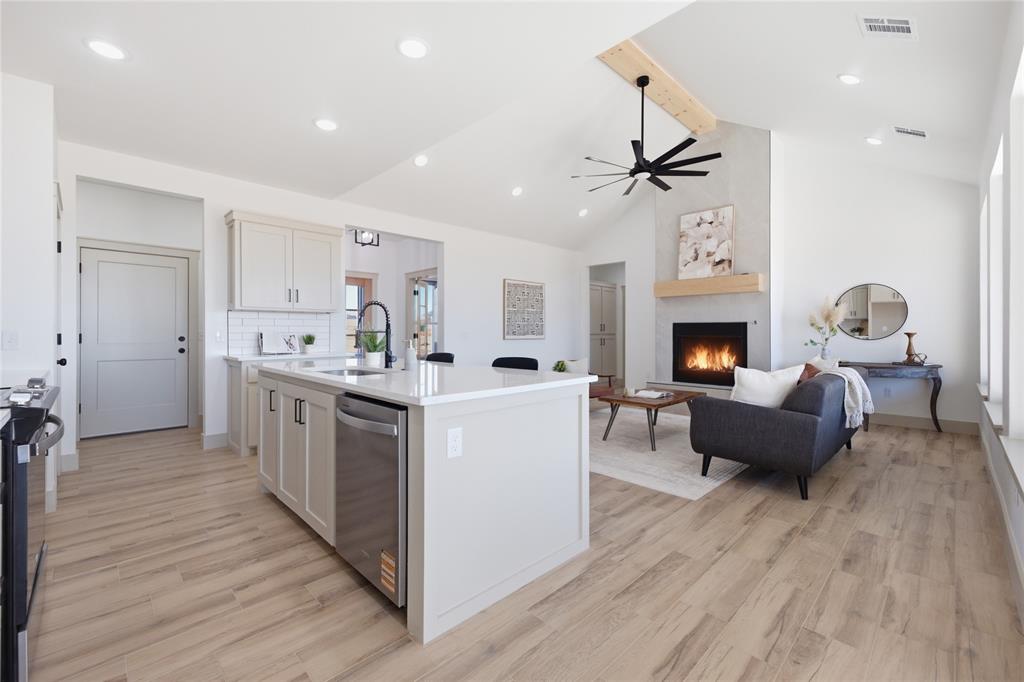 Tessa Hood Realtor – Kitchen to living room open view with vaulted ceiling at 2439 Wind River Cir, Blanchard Oklahoma