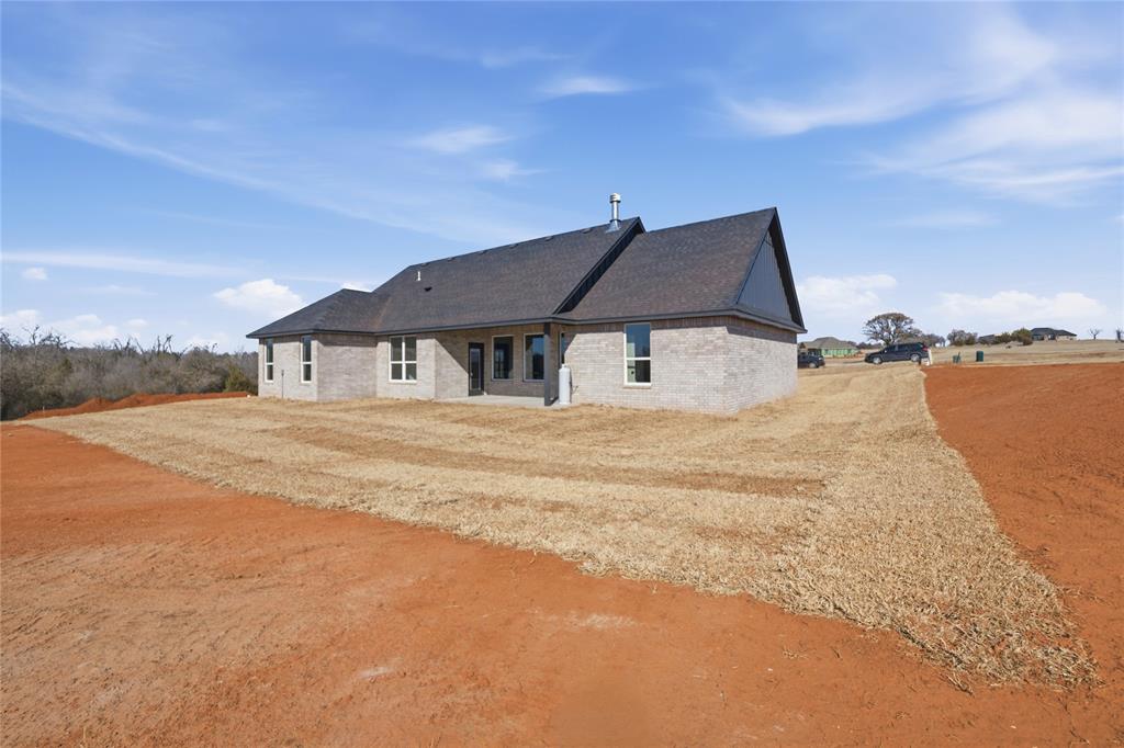 Tessa Hood Realtor – Rear exterior view of new construction home at 2439 Wind River Cir, Blanchard Oklahoma